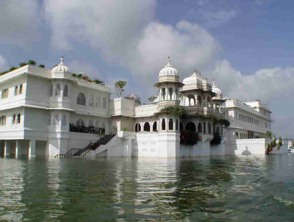 a white building with a large body of water