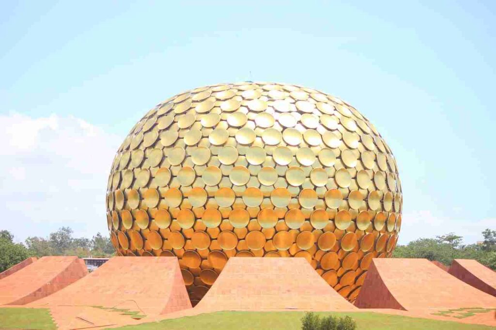 a large gold dome with a few triangular objects